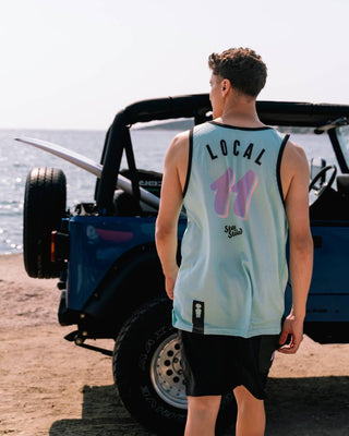 Model wearing We Ride Local Team Mint jersey – back view showing breathable mesh, loose fit, and number 11 printed on the back.